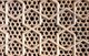 A jali (or jaali, Gujarati જાળી) is the term for a perforated stone or latticed screen, usually with an ornamental pattern constructed through the use of calligraphy and geometry. Early work was performed by carving into stone, while the later used by the Mughals employed the technique of inlay, using marble and semi-precious stones. Jali typically use Floral geometric patterns.<br/><br/>Etimad-ud-Daula's Tomb (Urdu: اعتماد الدولہ کا مقبرہ‎, I'timād-ud-Daulah kā Maqbara) is a Mughal mausoleum in the city of Agra in the Indian state of Uttar Pradesh.<br/><br/>Along with the main building, the structure consists of numerous outbuildings and gardens. The tomb, built between 1622 and 1628 represents a transition between the first phase of monumental Mughal architecture - primarily built from red sandstone with marble decorations, as in Humayun's Tomb in Delhi and Akbar's tomb in Sikandra - to its second phase, based on white marble and pietra dura inlay, most elegantly realized in the Tāj Mahal.<br/><br/>The mausoleum was commissioned by Nūr Jahān, the wife of Mughal emperor Jahangir, for her father Mirzā Ghiyās Beg, originally a Persian Amir in exile, who had been given the title of I'timād-ud-Daulah (Pillar of the State). Mirzā Ghiyās Beg was also the grandfather of Mumtāz Mahāl (originally named Arjūmand Bāno, daughter of Asaf Khān), the wife of the emperor Shāh Jahān, responsible for the construction of the Tāj Mahal.